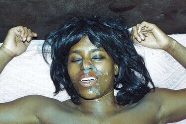 Dark doll getting her face creamed