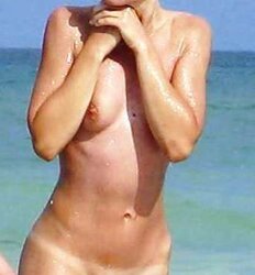 Secretly photographed nude on the beach