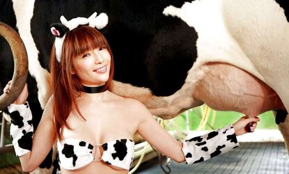 Nice Cowgirl Milking A Cow