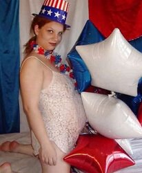 Pregnant redhead in white crimson and blue