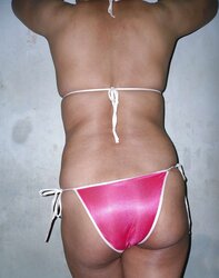 Indian mummy in net brassiere and wire thong