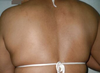 Indian mummy in net brassiere and wire thong