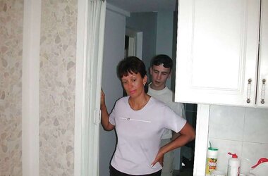 Russian mom Amalia with her son in the kitchen