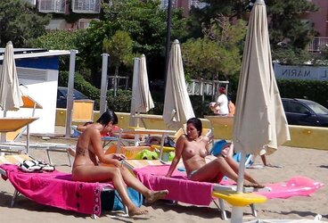 Dolls sunbathing on italian beach of the adriatic coast