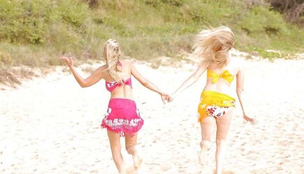 2 molten blondes on a beach