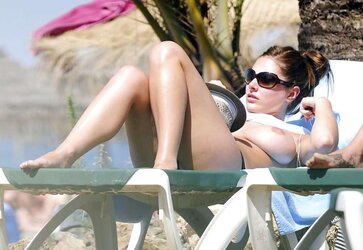 Lucy Pinder Bare-Breasted Candids at the Beach