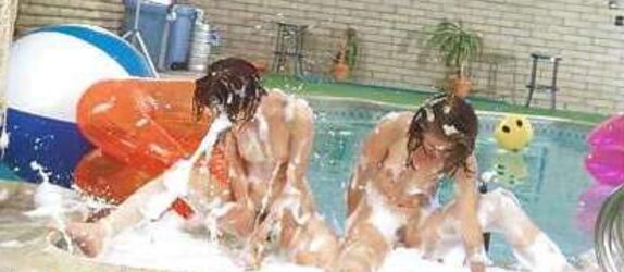2 teenie dolls in a soapy pool