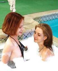 2 teenie dolls in a soapy pool
