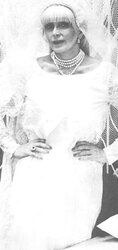 Vintage adult movie star Candy Samples in bridal garment