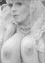 Vintage adult movie star Candy Samples in bridal garment