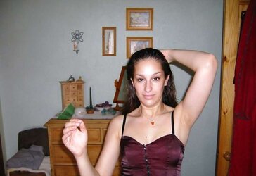 Fledgling brown-haired posing in her bedroom