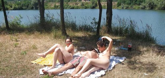 Real nudists sunbathing bare