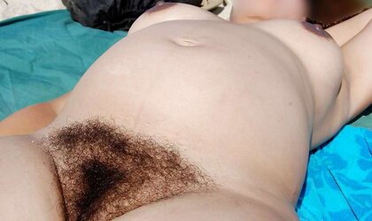 Pregnant, fur covered wifey on naked beach
