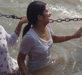 Indian Women bathing at sea ganga
