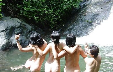 Asian gals at waterfall.