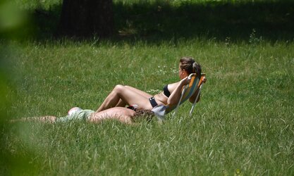 Lady sunbathing in the park I