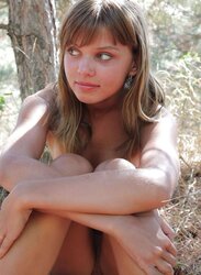Nude ultra-cute teenager at the woods