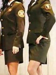 Femmes in uniforms wearing nylons..